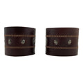 A stylish Men's Wristband by Hide & Drink, featuring a criss-cross design made from high-quality full grain leather. This handmade accessory showcases expert craftsmanship with fine stitching, making it a perfect fit for any outfit. Men's Wristband Handmade, Full Grain Leather, StockyardX, Small Batch Production, Hand Cut, Hand Sewn, Fire Branded, Artisan, Handmade in La Antigua Guatemala & Oaxaca Mexico.
