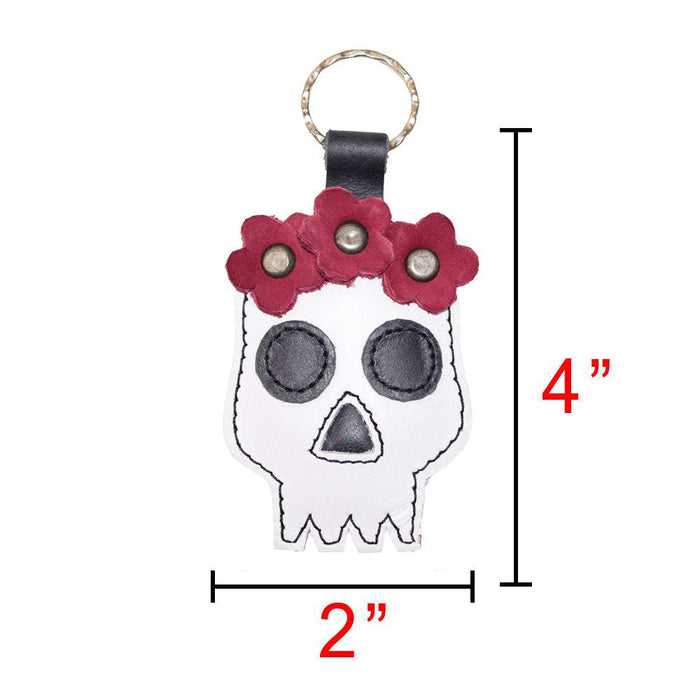 A clear visual of the Mexican Skull Keychain by Hide & Drink with dimensions, emphasizing its compact size and artistic design. An excellent accessory for Day Of The Dead, made from Full Grain Leather, this key ring is handmade through small batch production, reflecting the artisan craftsmanship of La Antigua Guatemala & Oaxaca Mexico.