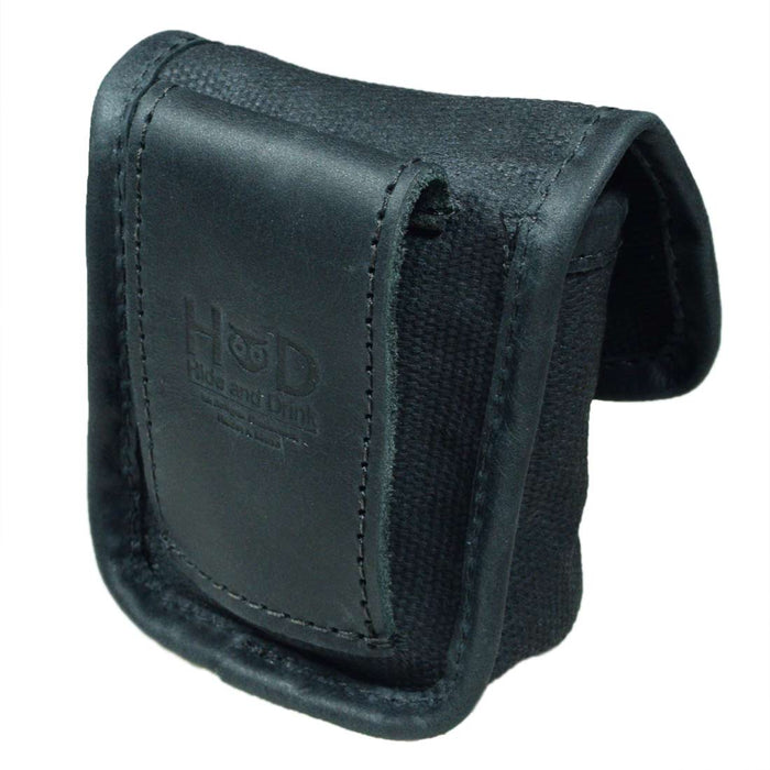 Hide & Drink's Mini Belt Pouch in black with leather accents, showcasing a refined design suited for outdoor use. This squared pouch features a belt loop, perfect as a multi-purpose hip bag crafted from water-resistant waxed canvas, representing stockyardX's commitment to artisan craftsmanship made in La Antigua Guatemala & Oaxaca Mexico.