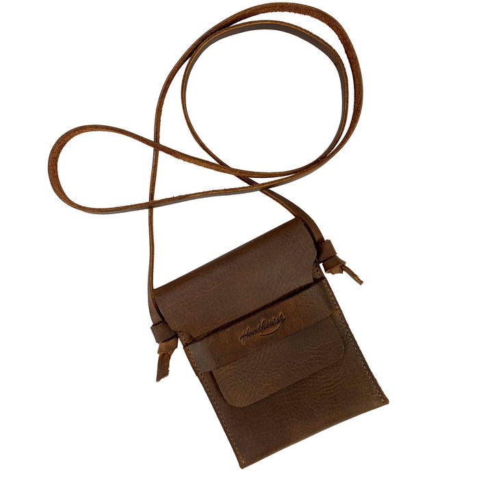 Mini Travel Bag by Heather's featuring a stylish brown leather design. This Mini Travel Bag Handmade from Full Grain Leather is a classic organizer, coin pouch, and storage case for ID, credit cards, and cash. StockyardX, Small Batch Production, Hand Cut, Hand Sewn, Fire Branded, Artisan, Handmade in La Antigua Guatemala & Oaxaca Mexico.