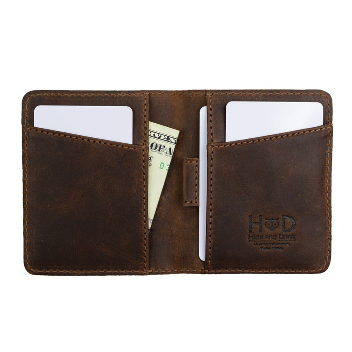 Interior layout of Hide & Drink's Minimalist Bi-fold Wallet displaying slots for cards and a space for cash. Crafted from durable full grain leather, this everyday accessory holds up to 6 cards plus folded bills, emphasizing handmade quality, fire branding, and the artisan touch typical of small batch production.