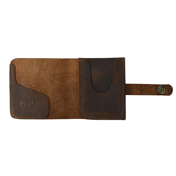 Inside view of the Minimalist Bi-fold Wallet by Hide & Drink, featuring a slot for cards and cash. This practical wallet can hold up to 5 cards plus flat bills, crafted from high-quality Full Grain Leather. A perfect everyday accessory, it highlights the artisan touch of small batch production, being handmade through hand cutting and hand sewing in La Antigua Guatemala & Oaxaca Mexico.