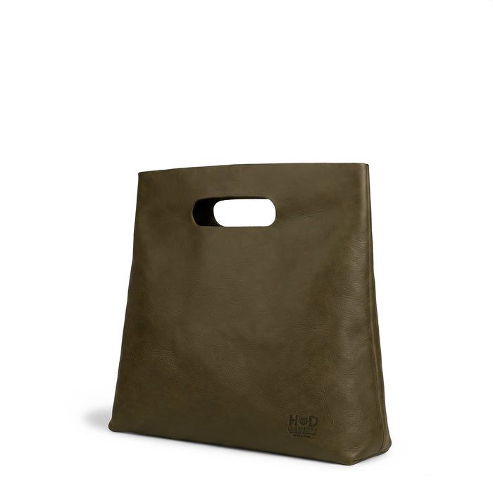 Side profile of the Minimalist Boho Handbag by Hide & Drink, illustrating its elegant and functional design. This Minimalist Handbag for Women doubles as a versatile Tote Bag, constructed from premium Full Grain Leather, showcasing StockyardX's focus on artisan craftsmanship through Hand Cut and Hand Sewn processes, proudly made in La Antigua Guatemala & Oaxaca Mexico.
