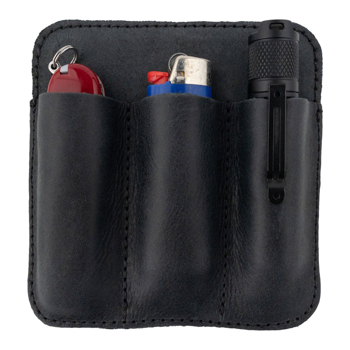 Hide & Drink Minimalist Tool Pocket filled with essential tools like lighters, emphasizing practicality. Made from Full Grain Leather, this Tool Pocket Pouch is carefully hand sewn and cut, ensuring unique artisan quality from La Antigua Guatemala with a focus on small batch production.