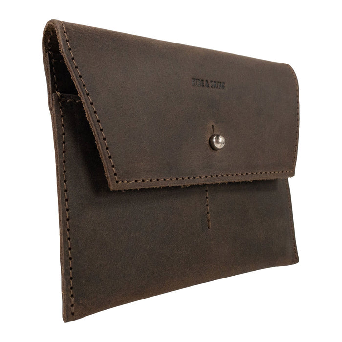 Side profile of Hide & Drink Minimalist Wallet showcasing its elegant design and secure snap closure. This durable cash organizer, made from attractive full grain leather, represents the quality artistry of handmade goods from La Antigua Guatemala & Oaxaca Mexico.