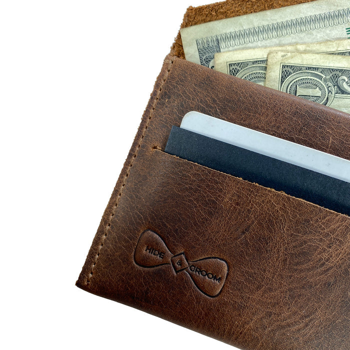 Close-up view of the Hide & Groom Minimalist Wallet showcasing its full grain leather texture and ample storage for cards and cash. Designed to be stylish and practical, this wallet is handcrafted in La Antigua Guatemala. Minimalist Wallet - Business Card & Money Holder, Stylish Compact Money Organizer, Full Grain Leather, StockyardX, Small Batch Production, Hand Cut, Hand Sewn, Fire Branded, Artisan, Handmade in La Antigua Guatemala & Oaxaca Mexico.