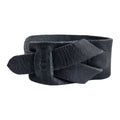 Hide & Drink's Minimalist Wristband captured in a sleek black full grain leather variation. This stylish cuff features a unique texture and adjustable strap, handcrafted by artisans in La Antigua Guatemala. An elegant bracelet by StockyardX representing small batch production and artisan quality.