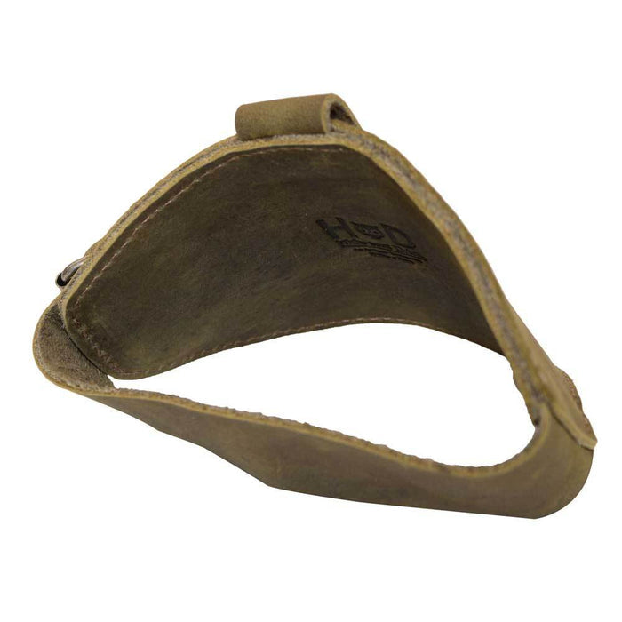 Inside view of the olive green Motorcycle Boot Protector by Hide & Drink, highlighting its practical design for securing shoes from shifter damage. Crafted from high-quality full grain leather, this rustic guard reflects artisan skill and dedication, handmade in La Antigua Guatemala.