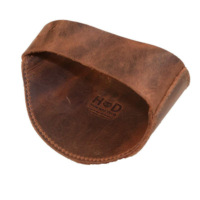 Underside of the Motorcycle Boot Protector by Hide & Drink, designed to secure your shoe and keep it protected against the shifter. Made from high-quality full grain leather, this rustic guard emphasizes small batch production with an artisan touch, handcrafted in La Antigua Guatemala.