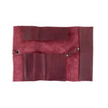 Hide & Drink Multi Purpose Pencil Roll displayed showing its skillful stitching and handcrafted quality. Ideal for organizing scissors, earphones, and other essentials, this rustic pouch embodies artisan craftsmanship.