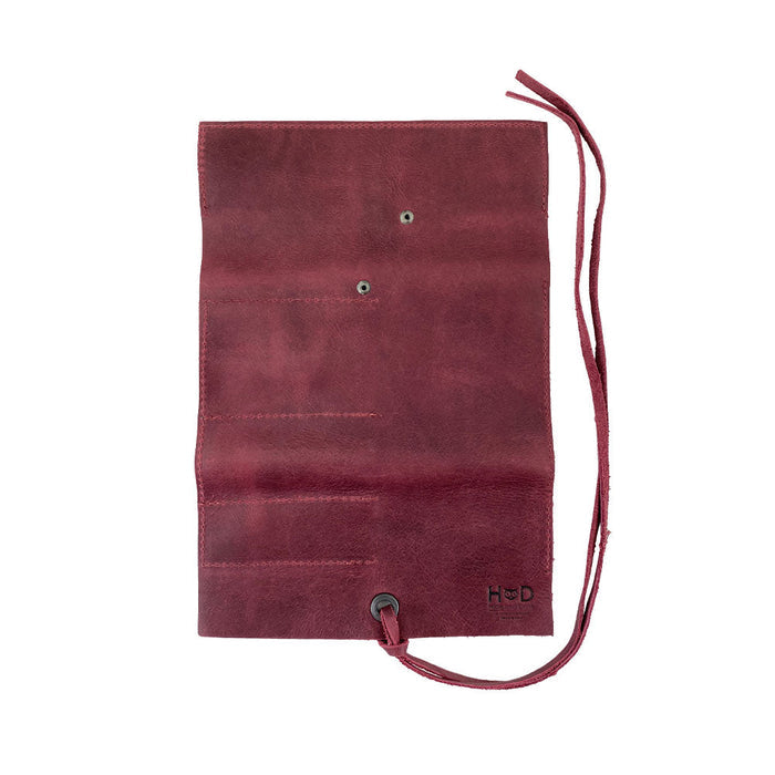 Hide & Drink Multi Purpose Pencil Roll in sleek black leather, showcasing its easy storage capabilities. This handmade organizer is perfect for work and craft supplies, representing artisan quality from La Antigua Guatemala & Oaxaca Mexico.