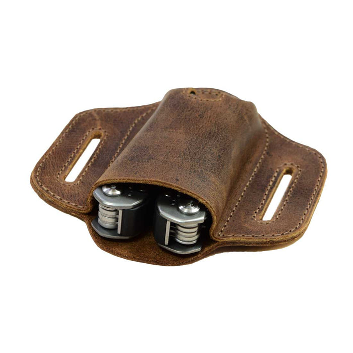 Hide & Drink Multitool Belt Sheath displayed with tools inside. This pocket knife set case demonstrates the brand's dedication to handmade quality. Ideal as a tool holster for waist, it's crafted from full grain leather and designed for outdoor adventures.