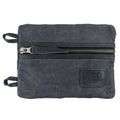 Side view of the black Multi-tool Pocket Pouch - XL by Hide & Drink, highlighting the zippered closure designed for easy access to tools and hardware. Multi-Tool Pocket Pouch XL, Compact Multipurpose EDC Zippered Bag, Mini Camping Tool Case, Knife Holster, Handmade Slim Organizer, Waxed Canvas, StockyardX, Small Batch Production, Artisan, Handmade in La Antigua Guatemala & Oaxaca Mexico.
