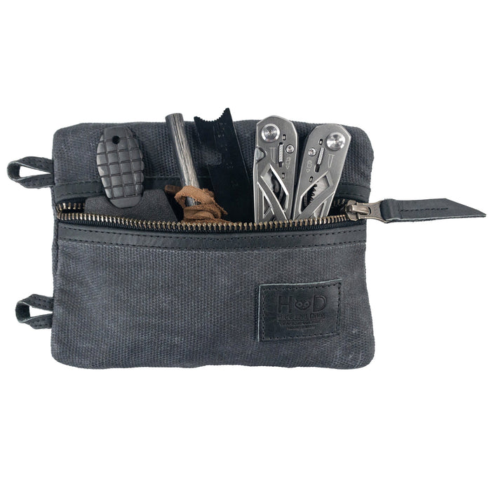 Multi-tool Pocket Pouch - XL by Hide & Drink displayed alongside a business card, showcasing its suitability as a thoughtful gift for outdoor enthusiasts and tool lovers. Multi-Tool Pocket Pouch XL, Compact Multipurpose EDC Zippered Bag, Knife Holster, Handmade Slim Organizer, Waxed Canvas, StockyardX, Small Batch Production, Artisan, Handmade in La Antigua Guatemala & Oaxaca Mexico.
