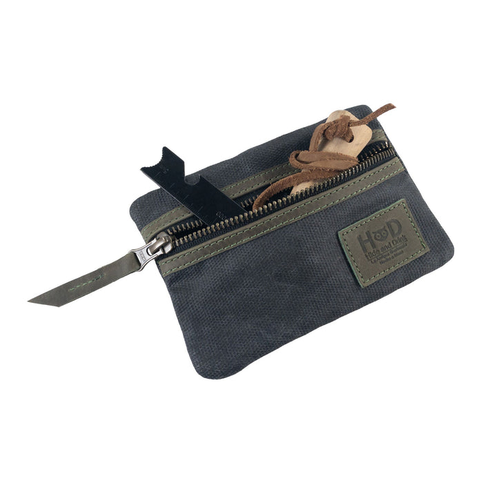 Open navy Multi-tool Pocket Pouch by Hide & Drink, displaying compartments for versatile tool storage.