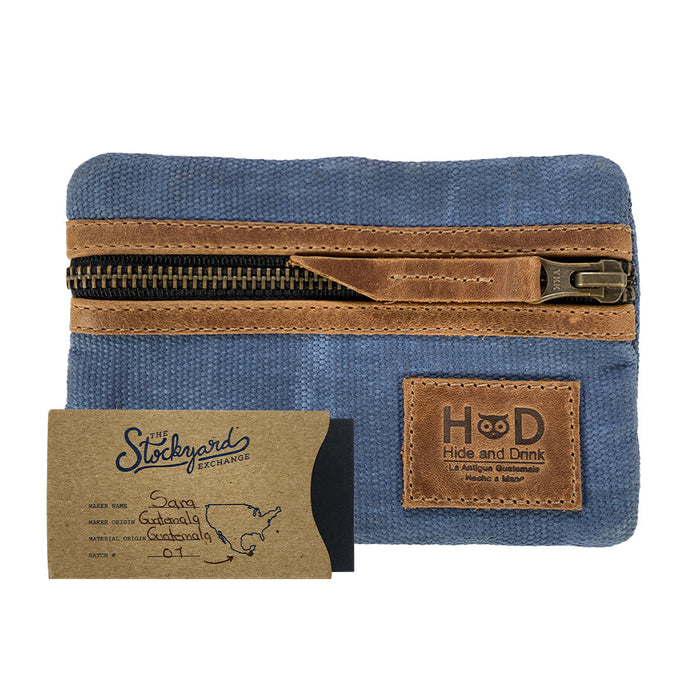 Packaging of the blue Multi-tool Pocket Pouch by Hide & Drink, featuring tags that emphasize its handmade production in La Antigua Guatemala.