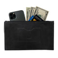 A sleek black rectangular zippered handbag by Hide & Drink, designed for women, featuring a card slot filled with cash and a smartphone. This female purse is made from full grain leather and reflects artisan crafting techniques showcasing small batch production, hand cut and sewn in La Antigua Guatemala & Oaxaca Mexico.