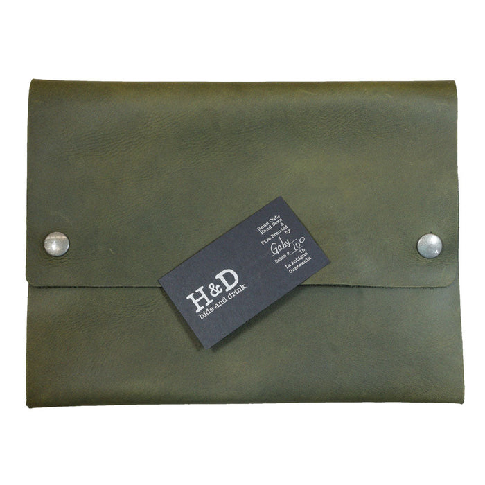 Hide & Drink's olive green Multipurpose Portfolio with a business card, demonstrating its functional design for daily organization of important items, crafted from durable Full Grain Leather. Handmade in La Antigua Guatemala & Oaxaca Mexico.