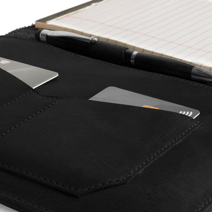 Close-up of the interior of the black Leather Worx Notepad Case 5 x 8 In. featuring a card slot and pen, made from full grain leather. Notepad Cover (5 x 8 In. Notepad Not Included) Sturdy, Durable Material Perfect for Storing Journal, Full Grain Leather, StockyardX, Small Batch Production, Hand Cut, Hand Sewn, Fire Branded, Artisan, Handmade in La Antigua Guatemala & Oaxaca Mexico.