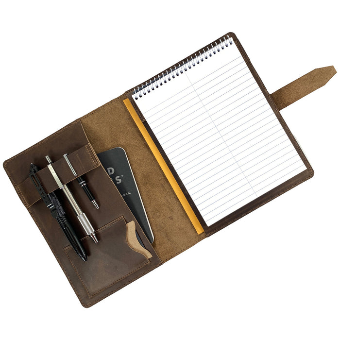 Open view of Leather Worx Notepad Cover, displaying a notepad and pen with its luxurious interior. This Notepad Cover not only provides ample space but also assures durability with its full grain leather material, crafted in a stylish and professional manner by artisans in La Antigua Guatemala.