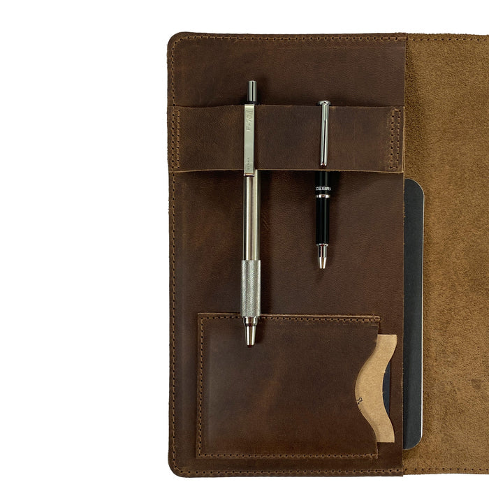 Focused view of pen slots inside the Leather Worx Notepad Cover, emphasizing the handmade quality and attention to detail. This Notepad Cover ensures a sophisticated organization solution with its sturdy, full grain leather, made with artisanal craftsmanship in La Antigua Guatemala.
