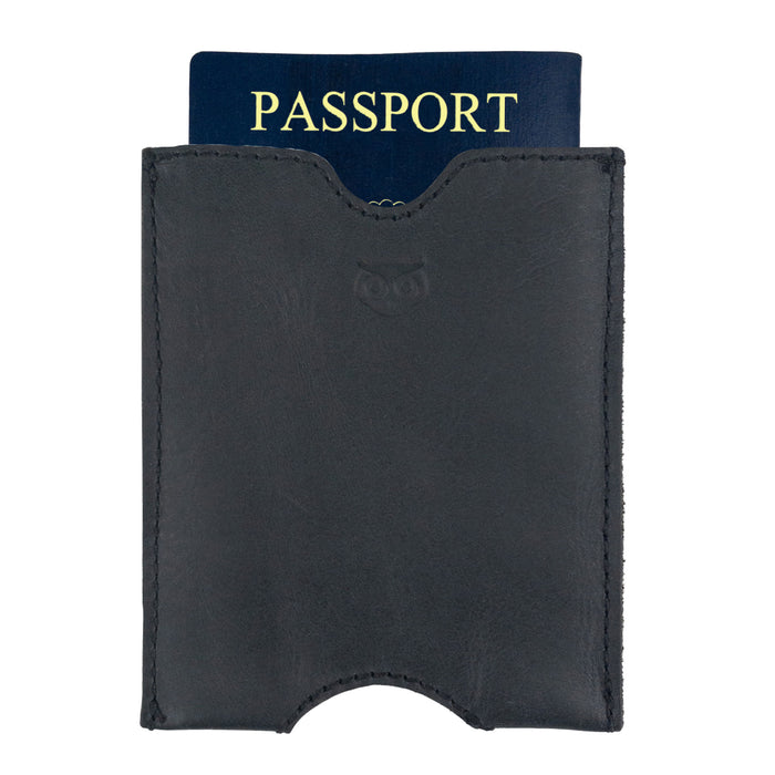 Hide & Drink Passport Sleeve with a passport inserted, demonstrating its snug fit. This Travel Passport Pocket Sleeve is expertly crafted from Full Grain Leather, emphasizing the artisan touch from La Antigua Guatemala & Oaxaca Mexico.