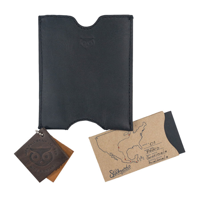 Hide & Drink Passport Sleeve showcasing a unique leather tag, emphasizing its small batch production. This handmade Travel Passport Pocket Sleeve, crafted from Full Grain Leather, represents true artisan quality from La Antigua Guatemala & Oaxaca Mexico.