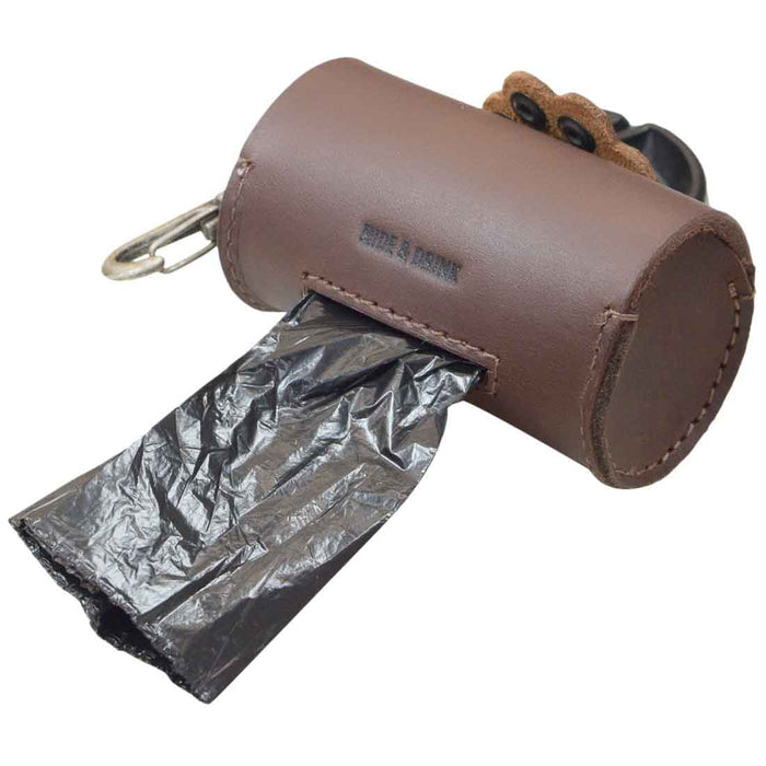 Paw Poop Pouch from Hide & Drink, showcasing a practical design with the ability to dispense bags. This Full Grain Leather pouch is a must-have for pet owners, ideal for dog walker essentials. Artisan-made in La Antigua Guatemala & Oaxaca Mexico, ensuring quality through small batch production.