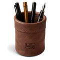 Leather Worx Pen Organizer featuring a stylish design with assorted pens and pencils inside. This Pen Organizer Cylinder Pencil Holder is perfect for work and school, made from Full Grain Leather, showcasing small batch production, artisan craftsmanship, and handmade quality from La Antigua Guatemala & Oaxaca Mexico.