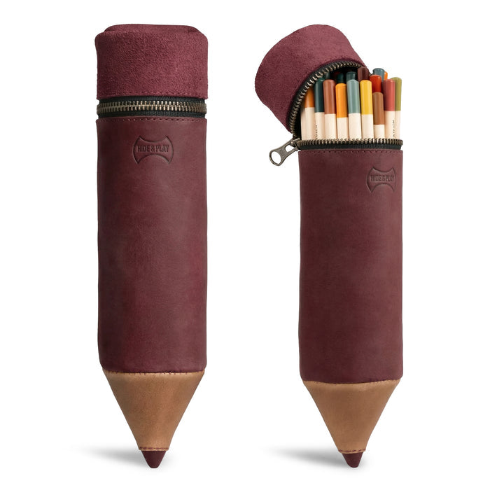 A stylish Pencil-Shaped Case from Hide & Play, crafted from full grain leather, perfect for organizing pens, pencils, markers, and office accessories. This zippered bag showcases artisanal craftsmanship, featuring small batch production, hand cut, hand sewn, and fire branded elements. Handmade in La Antigua Guatemala.