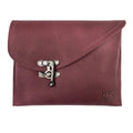 Front view of the Petite Vintage Clutch Bag by Hide & Drink, showcasing its sleek design and vintage clasp. This handmade clutch is crafted from full grain leather, perfect as a stylish evening bag or travel accessory. Ideal for those who appreciate artisan-made products from small batch production in La Antigua Guatemala & Oaxaca Mexico.