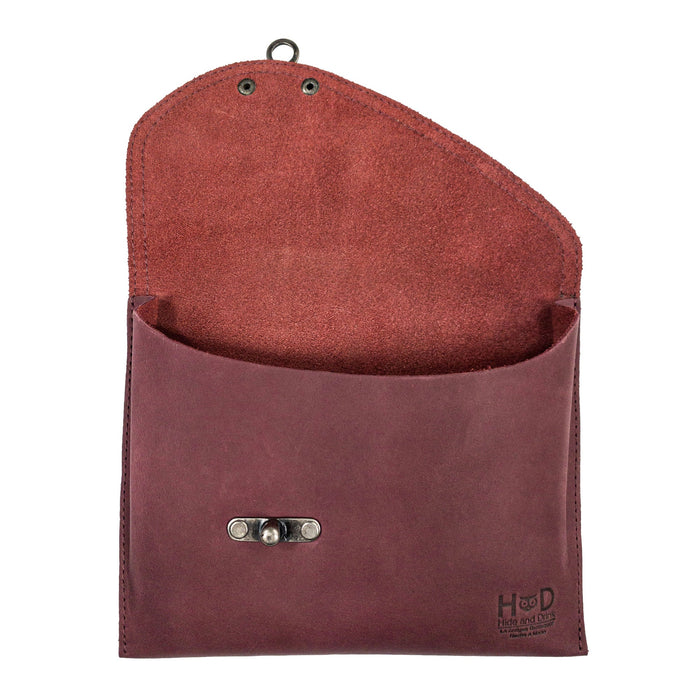 Open interior view of the Petite Vintage Clutch Bag by Hide & Drink, highlighting its spacious design. This unique vintage handbag features a soft raw natural leather lining, crafted from full grain leather, making it an excellent choice for a travel accessory. Hand cut, hand sewn, and handmade in La Antigua Guatemala & Oaxaca Mexico.