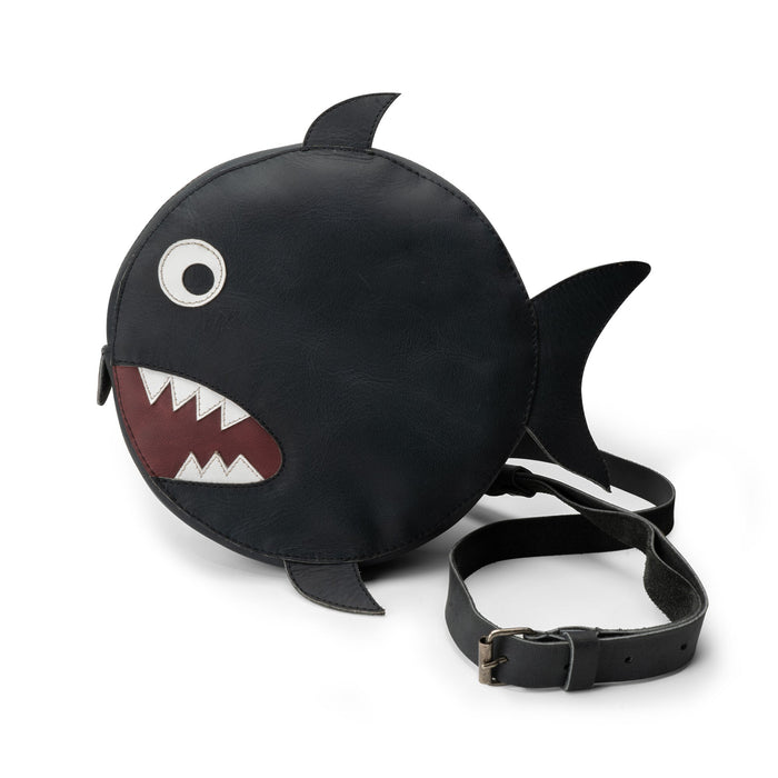 Tudi Frudi's Piranha-Shaped Shoulder Bag features a playful circular design that resembles a piranha, perfect for adding a whimsical touch to any outfit. This Piranha-Shaped Circular Shoulder Bag is crafted from Full Grain Leather, showcasing artisanal quality in its handmade construction with small batch production methods, ideal for casual outings.