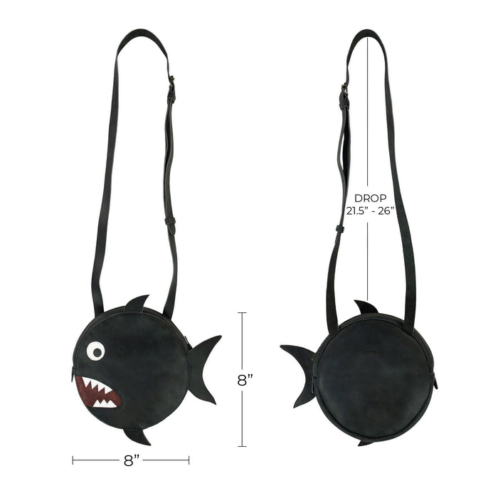 Visualize the dimensions of Tudi Frudi's Piranha-Shaped Shoulder Bag, a perfect accessory for any outfit. This Piranha-Shaped Circular Shoulder Bag combines playful design with practicality, made from Full Grain Leather reflecting small batch artisan production methods, handmade with love in La Antigua, Guatemala.