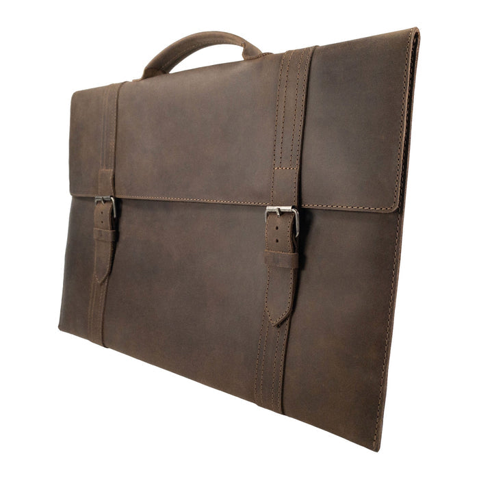 Side angle of the Hide & Drink Portable Laptop Case illustrating its ergonomic design crafted from Full Grain Leather, featuring hand cut and sewn details with a cozy inner lining for protection and durability.