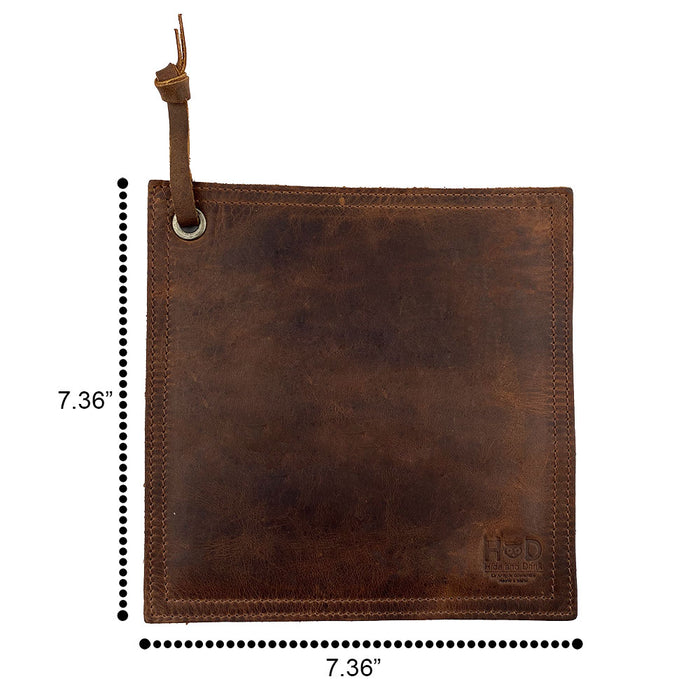 Hide & Drink Pot Pad in rich brown leather with a rustic look. This double-layered potholder combines durability with a unique artistic touch, perfect for any kitchen.