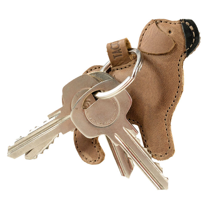 Functional Pug Keychain by Taco Dog featuring a charming design while securely holding keys. This durable, all-natural full grain leather keychain has an adorable rustic look and rich handmade details, making it a fantastic gift for dog lovers. Lightweight and practical, it embodies artisan craftsmanship from La Antigua Guatemala & Oaxaca Mexico.