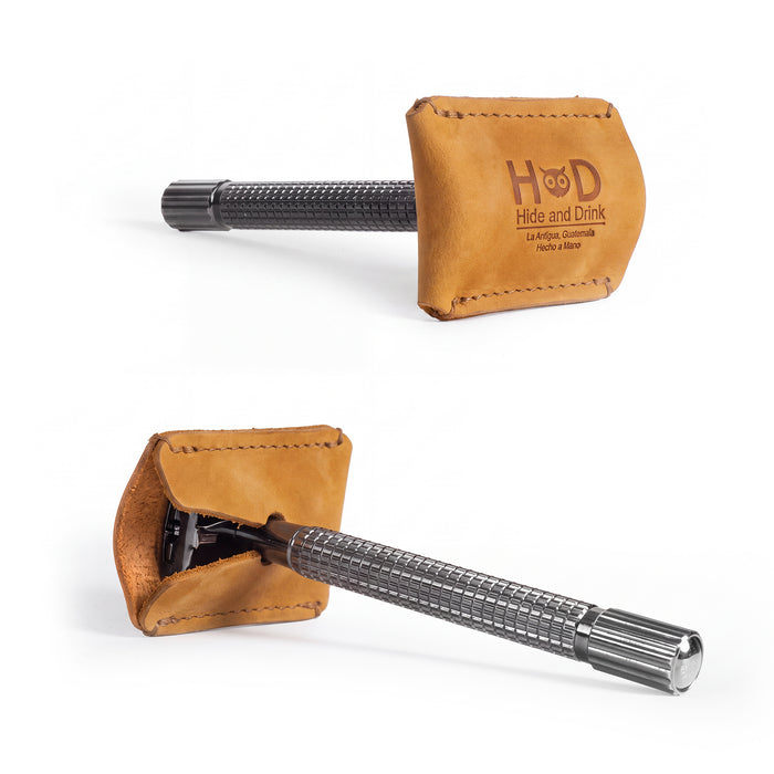 Highlighting the embossed logo on the Razor Head Cover by Hide & Drink, this full grain leather sheath protects your double edge safety razor. A practical shaving travel cover, it represents small batch production and artisan craftsmanship, being hand cut, hand sewn, and fire branded in La Antigua Guatemala & Oaxaca Mexico.