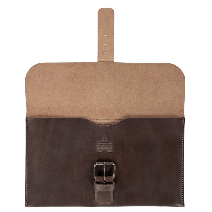 Back view of La Antigua's Rectangular Case for Notebook highlighting its premium full grain leather and classic sleeve design. Ideal for an 8.25 x 5 in. notebook, this protective cover is hand cut and hand sewn, with a fire branded touch representing the artisanal heritage from La Antigua Guatemala and Oaxaca Mexico. A perfect travel accessory for keeping your journal secure.