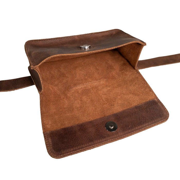 Open view of Heather's Rectangular Fanny Pack, demonstrating its elegant and functional interior. This waist pouch is designed from full grain leather, offering longevity and style. Perfect as a small batch production piece, it reflects artisan skills in every hand cut and hand sewn detail, all made in La Antigua Guatemala & Oaxaca Mexico.