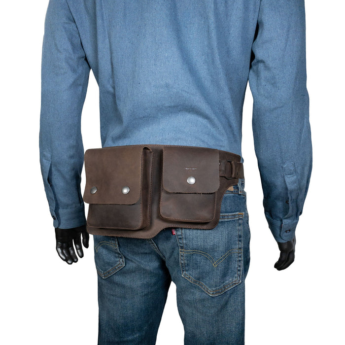 A model wearing the Hide & Drink Rectangular Waist Bag, demonstrating its stylish fit and practicality. This Waist Bag with Adjustable Belt is an ideal outdoor accessory, serving as a great tool holder for camping, crafted from high-quality Full Grain Leather. It's small batch production showcases hand-cut, hand-sewn artisan craftsmanship made in La Antigua Guatemala & Oaxaca Mexico.