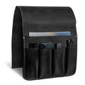 The side view of Hide & Drink‚Äôs Remote Control Holder in black leather demonstrates its pocket structure designed for efficient organization. This couch potato essential is ideal as an armchair caddy, merging style and functionality.