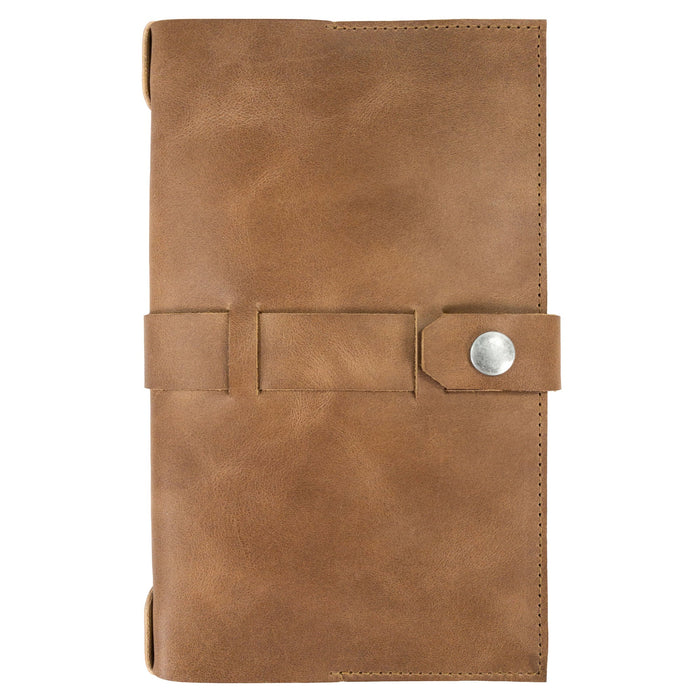 Hide & Drink's Riveted Field Note Cover for Moleskine (5 x 8.25 in.) Notebook NOT Included shown with accessories that complement its style. Made from full grain leather, this handcrafted item reflects artisan excellence from La Antigua Guatemala & Oaxaca, Mexico.