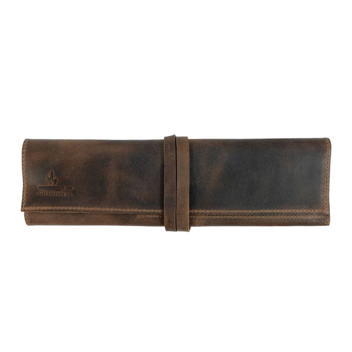 Closed Rustic Roll Bag for Chopsticks, exhibiting a stylish wrap design made from full grain leather by Cast Leather Co. This bag is perfect for compact storage, showcasing the beauty of artisan craftsmanship. Rustic Roll Bag for Chopsticks, Rustic Roll for Chopsticks, Case for Bamboo Wooden Chopsticks, Kitchen Organizer, Full Grain Leather, StockyardX, Small Batch Production, Hand Cut, Hand Sewn, Fire Branded, Artisan, Handmade in La Antigua Guatemala & Oaxaca Mexico.