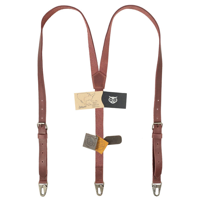Showcase of Hide & Drink Rustic Slim Suspenders in rust with high-quality leather finish, great for formal occasions like weddings. Attention to detail demonstrates artisan quality.