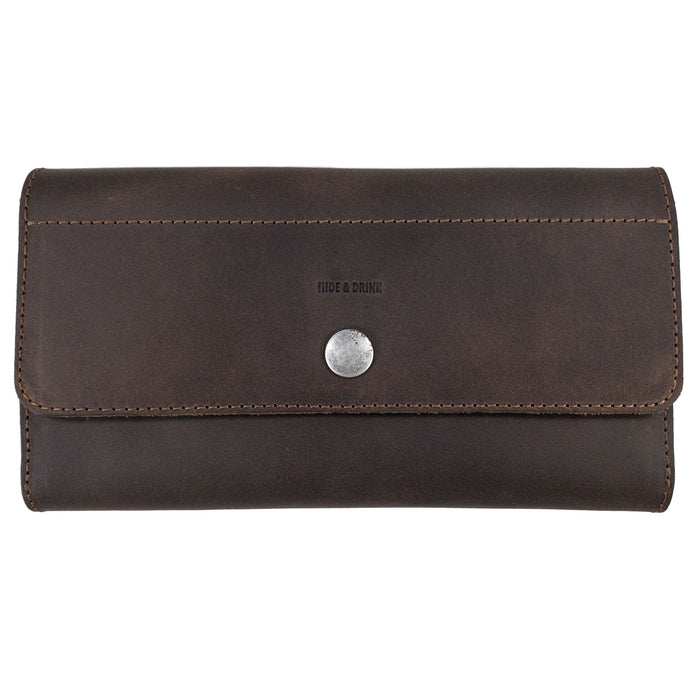Rustic Tri Fold Folio Wallet by Hide & Drink, showcasing a sleek exterior design made from full grain leather. This Minimalist Tri Fold Folio Wallet for Women features small batch production, hand cut and hand sewn craftsmanship, making it a perfect artisan piece handmade in La Antigua Guatemala & Oaxaca Mexico.