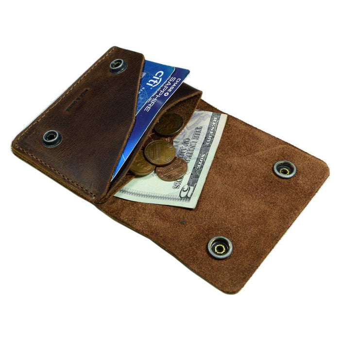 Inside the Hide & Drink Sandwich Card Holder showing its functionality. This Double Snap Card Holder can hold up to 4 cards plus folded bills, making it a practical cash organizer and coin case. Crafted from durable Full Grain Leather, it's an artisan-made accessory, hand cut and hand sewn, reflecting small batch production.