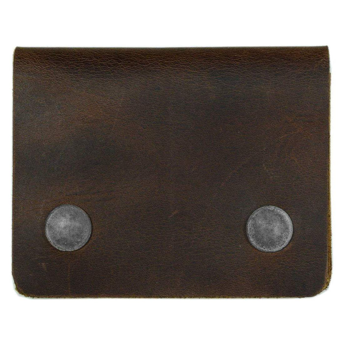 A top-down view of the Hide & Drink Sandwich Card Holder, highlighting its sleek and minimalist design. This handmade Double Snap Card Holder is perfect for up to 4 cards, coins, and folded bills. Made from Full Grain Leather, it’s an elegant cash organizer and coin case, with artisan touches from Guatemala.