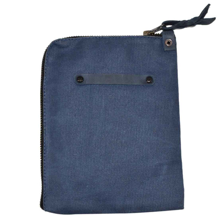 Scribbler Case in a light navy tone by Hide & Drink, made from Waxed Canvas. Designed for notebooks, emphasizing small batch production, hand cut, hand sewn, and artisan craftsmanship. Handmade in La Antigua Guatemala & Oaxaca Mexico.