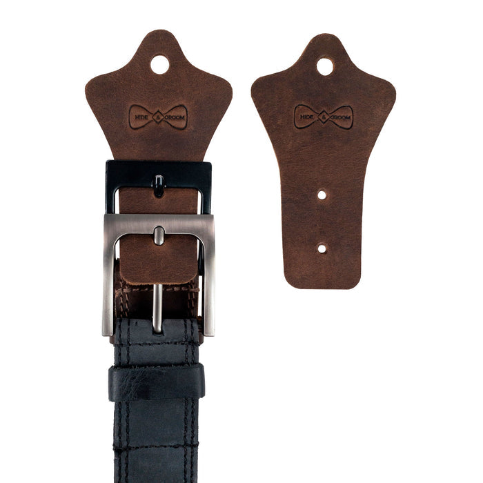 Hide & Groom Set of 2 Buckle Belt Hangers displayed with a belt, perfect for organizing in closets or entryways. These handcrafted full grain leather accessories are ideal for groomsmen or best man, showcasing rustic charm. Handmade in La Antigua Guatemala, these artisan belt hangers are fire branded, and designed for small batch production.